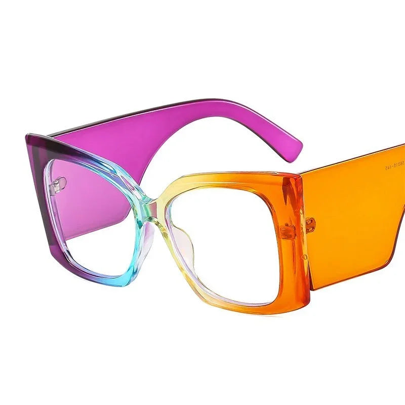The Vision Junkie Carmen cat-eye glasses with a vibrant purple to orange gradient frame