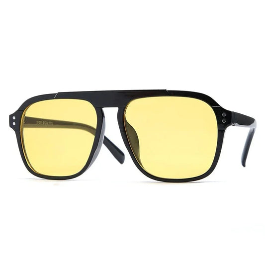 The Vision Junkie Alex sunglasses with black frames and yellow tinted lenses.