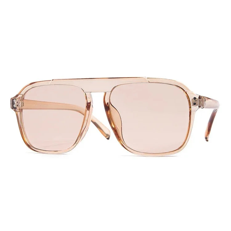 The Vision Junkie Alex aviator sunglasses with translucent peach frames and tinted lenses