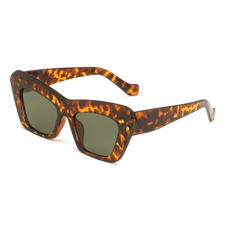 The Vision Junkie Krissie sunglasses with tortoise shell frames and dark green lenses.