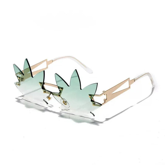 The Vision Junkie Haze sunglasses with light green leaf-shaped frames and clear lenses.